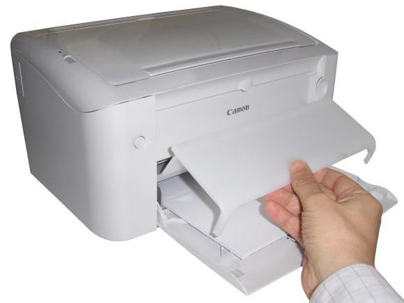 Canon i-SENSYS LBP3010 printer with paper output tray.