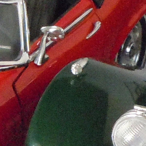 Close-up of a red toy car captured with Nikon Coolpix S8000.