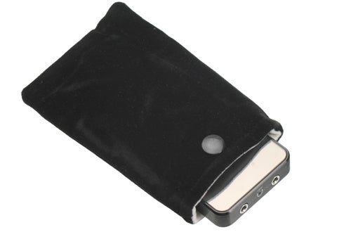 FiiO E7 portable headphone amplifier in a black velvet pouch.