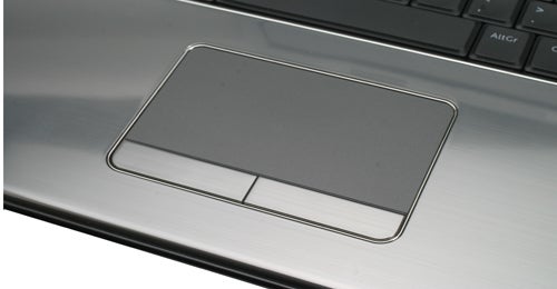 Close-up of Dell Inspiron 17R laptop's touchpad and palm rest.