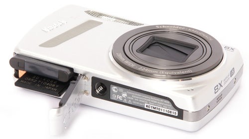 Kodak EasyShare M580 camera with open battery compartment.