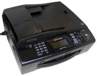 Brother MFC-J615W multifunction printer on a table.