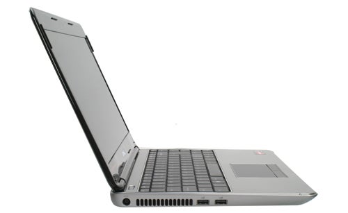 Dell Inspiron M301z laptop with lid open on white background.