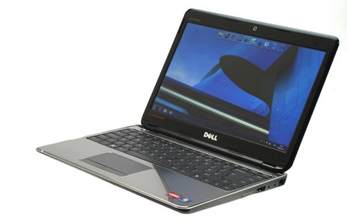 Dell Inspiron M301z laptop with open lid on white background.