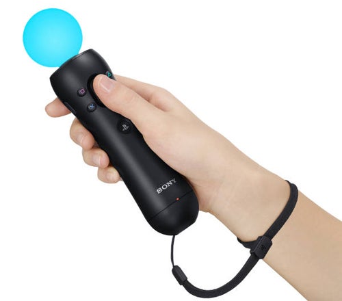 Hand holding a PlayStation Move controller.