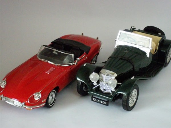 Model cars showcasing a red and black vintage design.