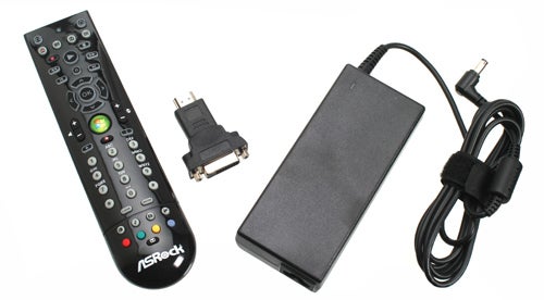 ASRock Core 100HT-BD remote control and power adapter.