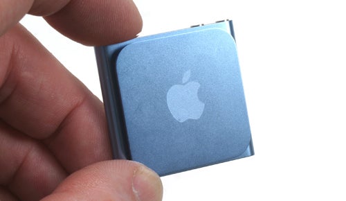 Hand holding a blue iPod nano 6th Generation.