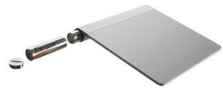 Apple Magic Trackpad with battery and battery cover removed.