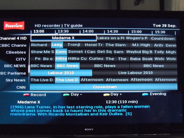 Philips HDT8520 displaying Freeview TV guide on screen.