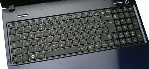 Samsung R590 laptop keyboard and partial view of screen.