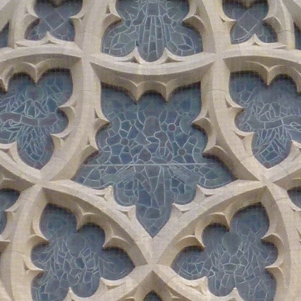 Detailed stonework of Gothic architecture window.