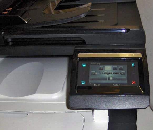 HP LaserJet Pro CM1415fn printer's control panel with touchscreen.