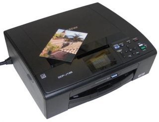 Brother DCP-J125 printer with a printed photo.