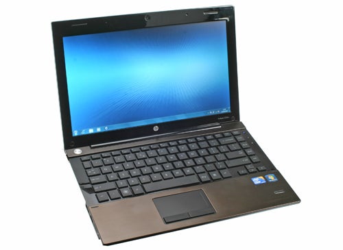 HP ProBook 5320m laptop open on white background.