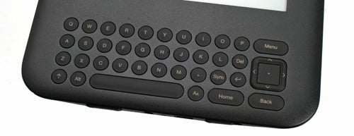 Close-up of Amazon Kindle 3 keyboard and navigation buttons.