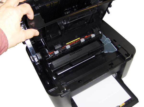Person changing toner in Samsung SCX-3205 printer