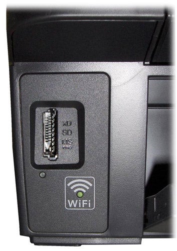 Epson Stylus SX425W printer's memory card slot and WiFi logo.