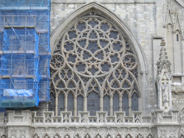 Detailed photo of Gothic church window and scaffolding.