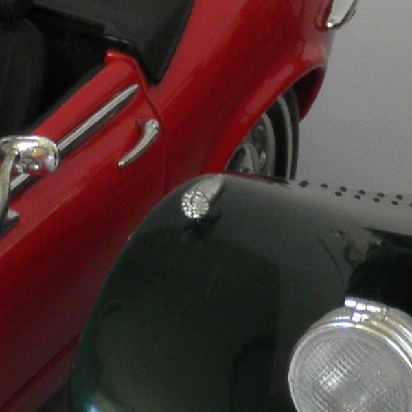 Close-up of a vintage car's front detailing.
