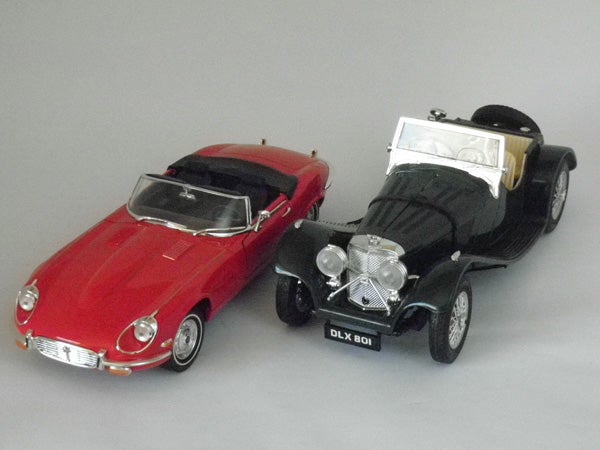 Toy model cars photographed with gray background.