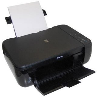 Canon PIXMA MP280 inkjet printer with paper loaded.