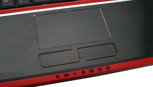 Close-up of MSI GX740 laptop touchpad and multimedia buttons.