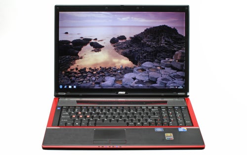 MSI GX740 gaming laptop with open lid displaying screen.