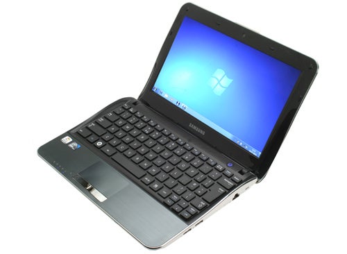 Samsung NF210 netbook open on desk with Windows screen