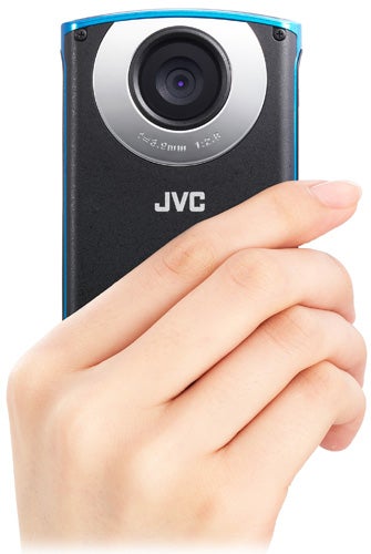 Hand holding JVC PICSIO GC-WP10A waterproof camera.