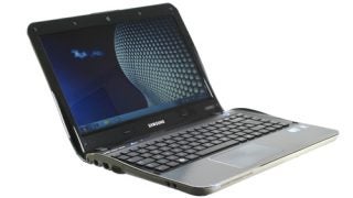 Samsung SF310 laptop with open lid on white background.