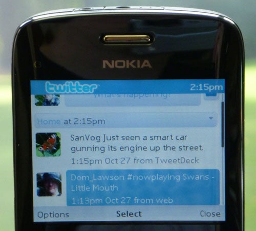 Nokia C3 displaying Twitter application on screen.