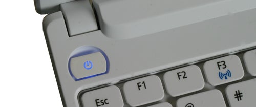 Acer Aspire D255 laptop power button and keyboard detail.