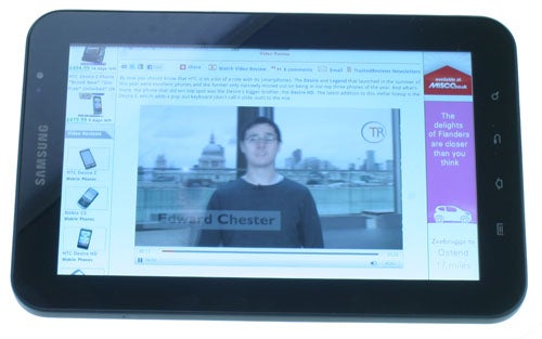 Samsung Galaxy Tab displaying a video review on screen.
