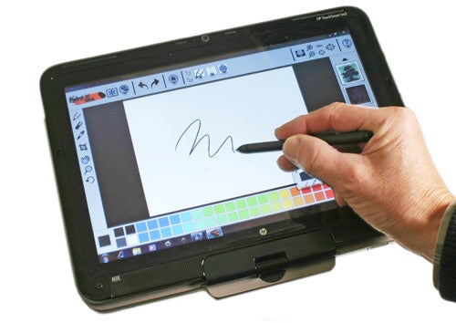 HP TouchSmart tm2 laptop with stylus on screen drawing application.