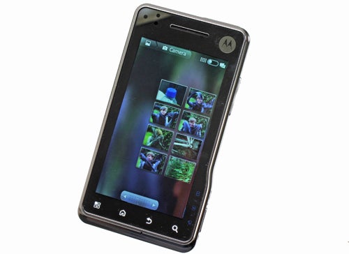 Motorola Milestone XT720 smartphone displaying gallery images.