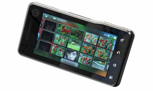 Motorola Milestone XT720 smartphone displaying camera gallery.