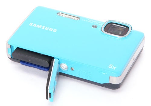 Samsung WP10 digital camera with open battery compartment.