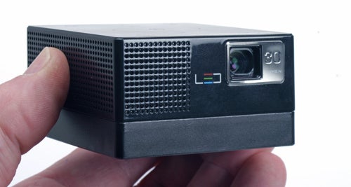 Hand holding Samsung H03 portable projector.