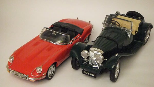 Photo of two model cars captured in studio lighting.