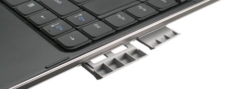 Close-up of Dell Latitude 13 laptop hinge and keyboard.