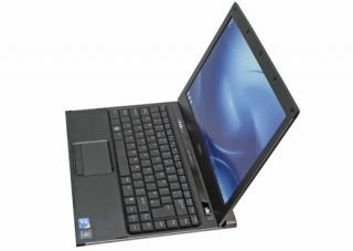 Dell Latitude 13 laptop open on a flat surface.