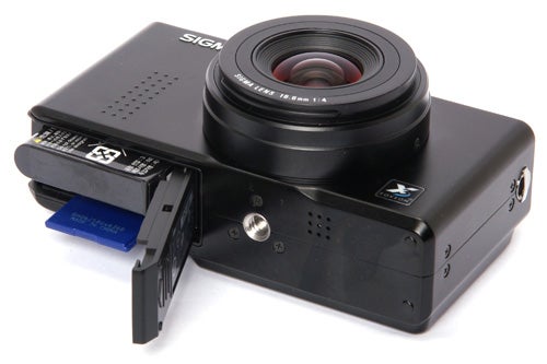 Sigma DP1x camera with open memory card slot.