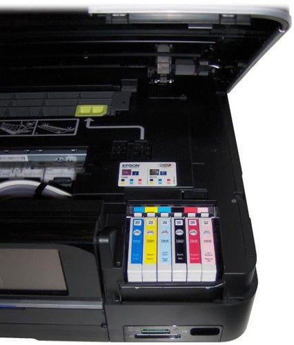 Epson Stylus Photo PX820FWD open with ink cartridges visible.