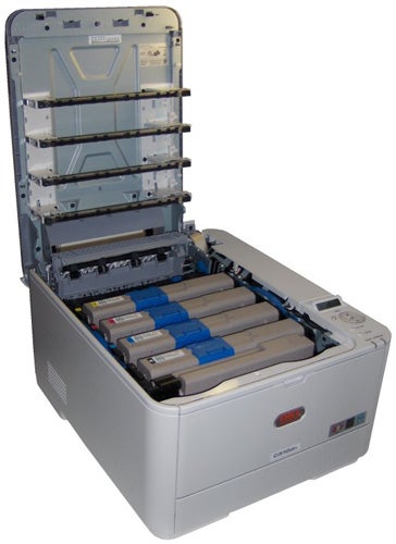OKI C310dn printer with open panels showing toner cartridges.