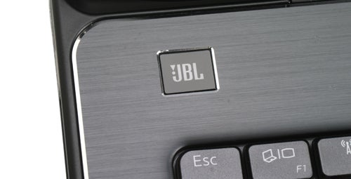 Close-up of JBL speaker logo on Dell XPS 17 keyboard.