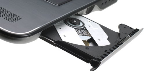 Dell XPS 17 laptop with open DVD drive tray.
