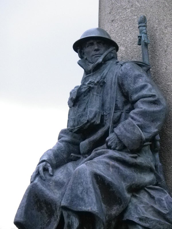 Close-up of a weathered soldier statue