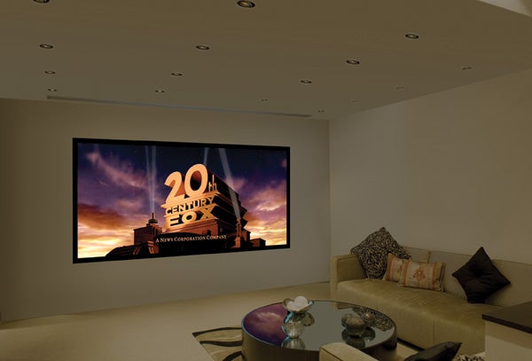 Projector screen displaying movie logo in a home theater setup.