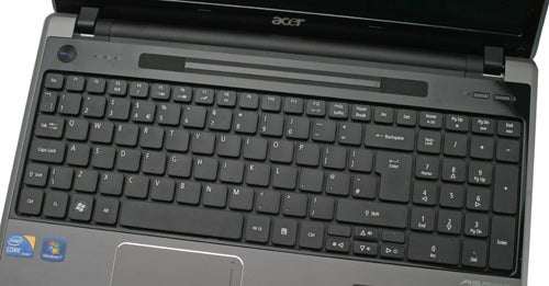 Acer Aspire 5745DG laptop displaying keyboard and screen.